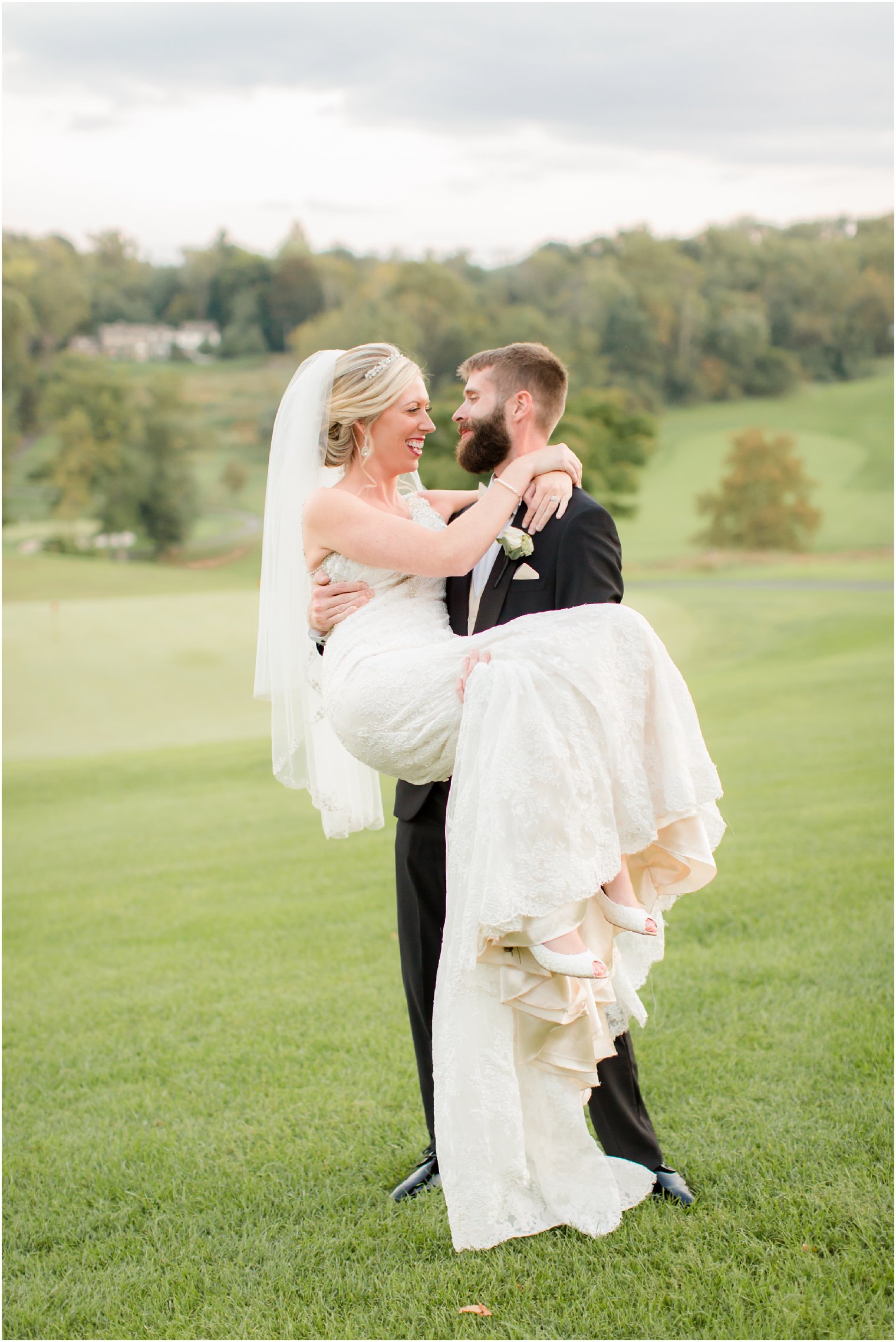 happy newlyweds photographed by Idalia Photography at Huntingdon Valley