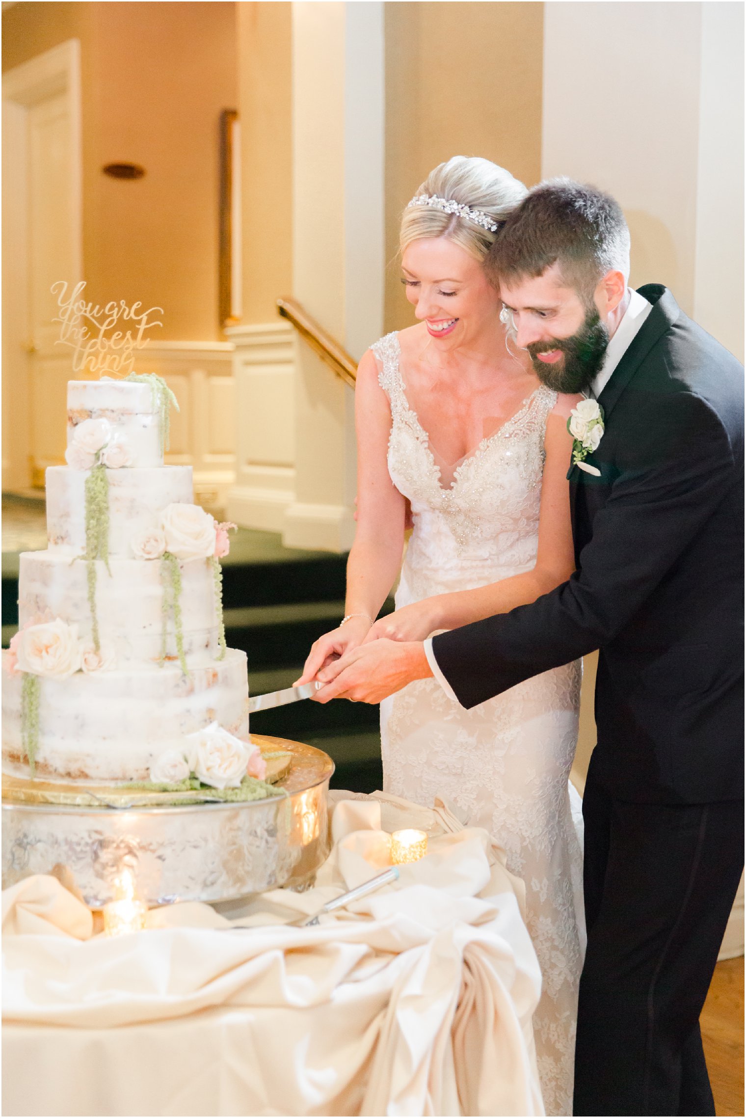 bride and groom cut cake by Bredenbeck’s Bakery at Huntingdon Valley Country Club