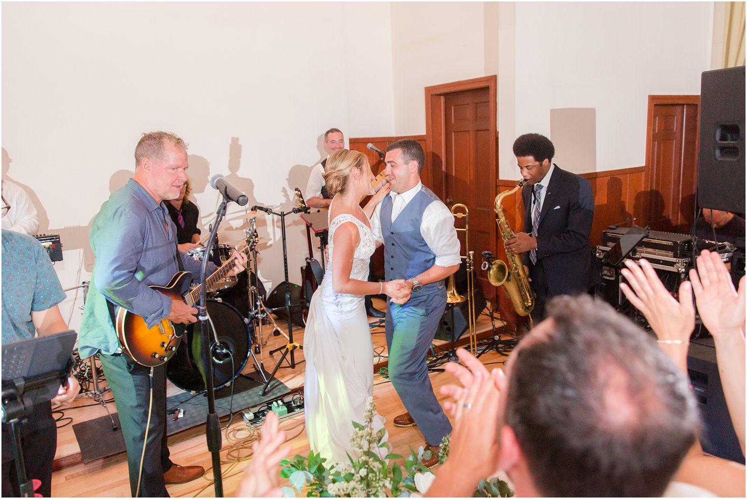 bride and groom dance to Brian Kirk and the Jerks during wedding reception photographed by Idalia Photography