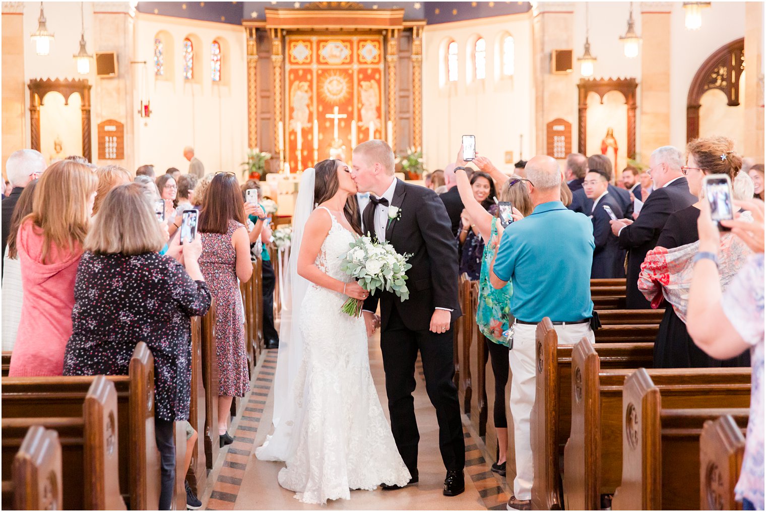 bride and groom recess down aisle in church