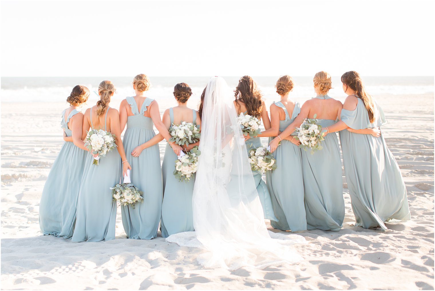 bridesmaids and bride on beach for Bridgeview Yacht Club wedding photos with Idalia Photography