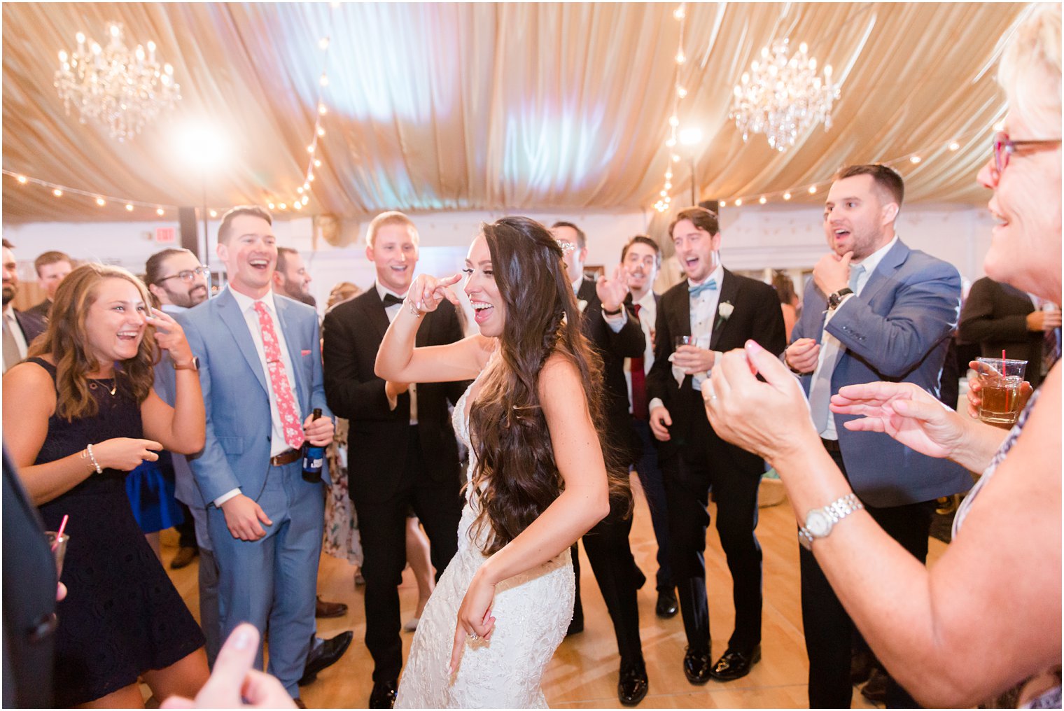 bride dances during wedding reception with Idalia Photography