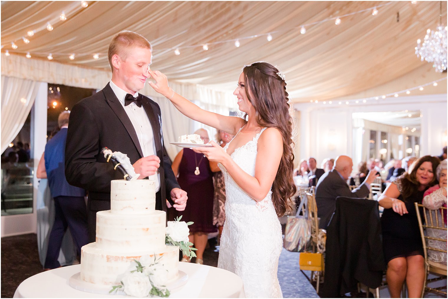 bride and groom cut cake with Idalia Photography at Bridgeview Yacht Club