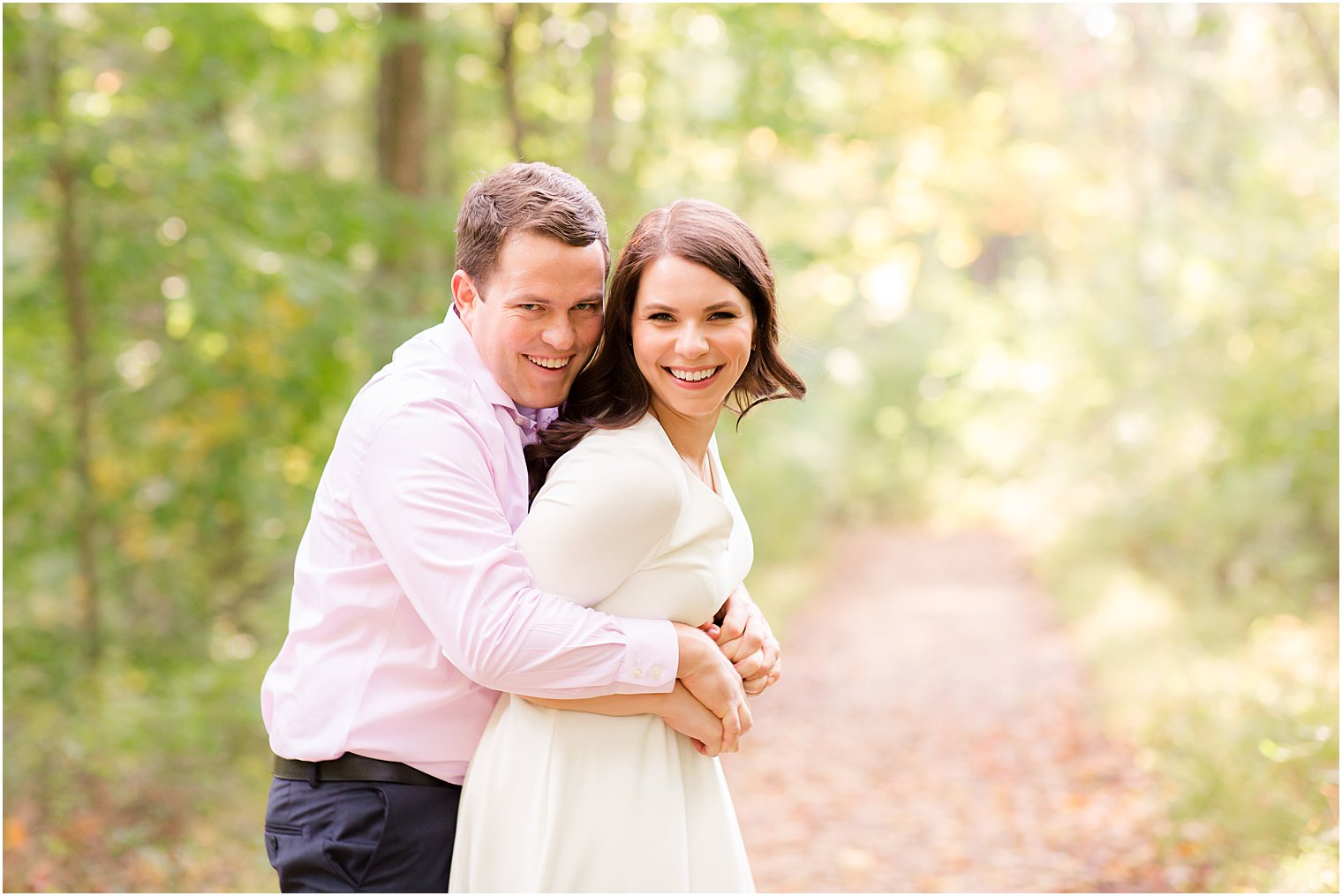 engaged couple laughs and hugs during NJ engagement photos