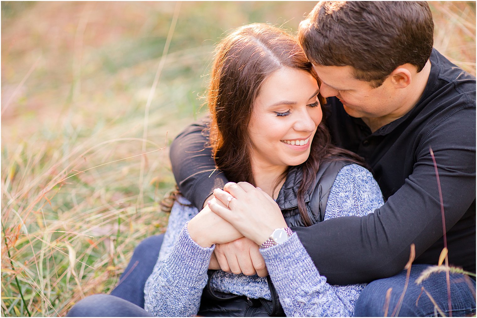 bride and groom cuddle during fall New Jersey engagement session