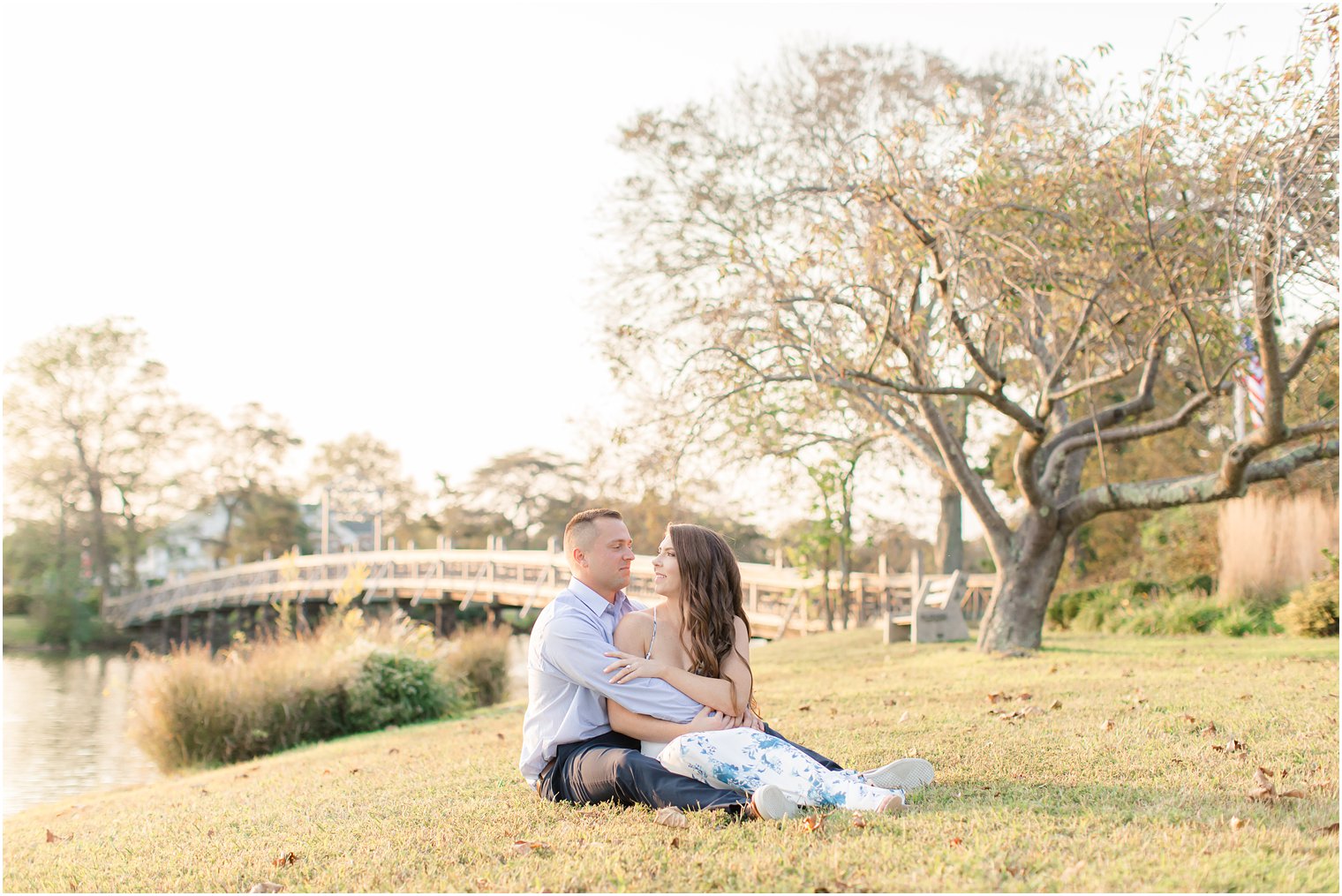 engaged couple sits together during Spring Lake NJ engagement photos