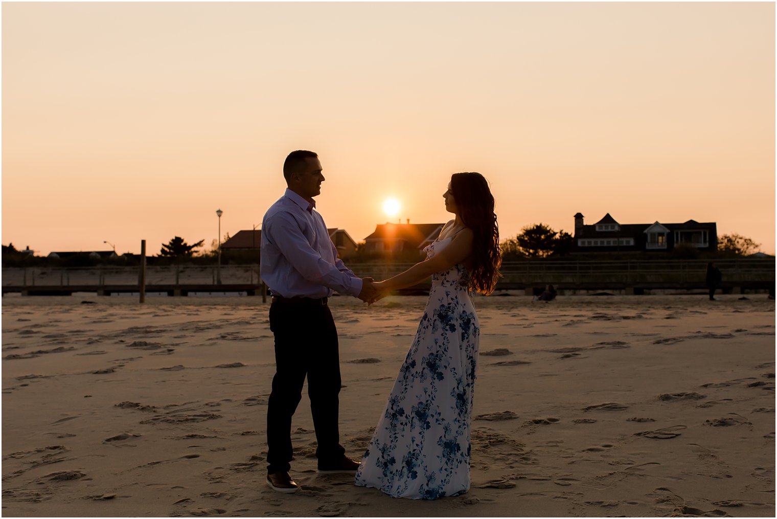 bride and groom dance on beach during Spring Lake Engagement session