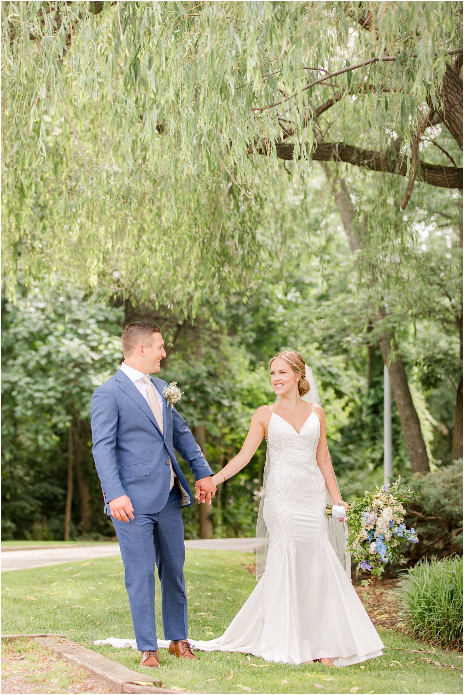 bride and groom hold hands walking through trail at Minerals Resort