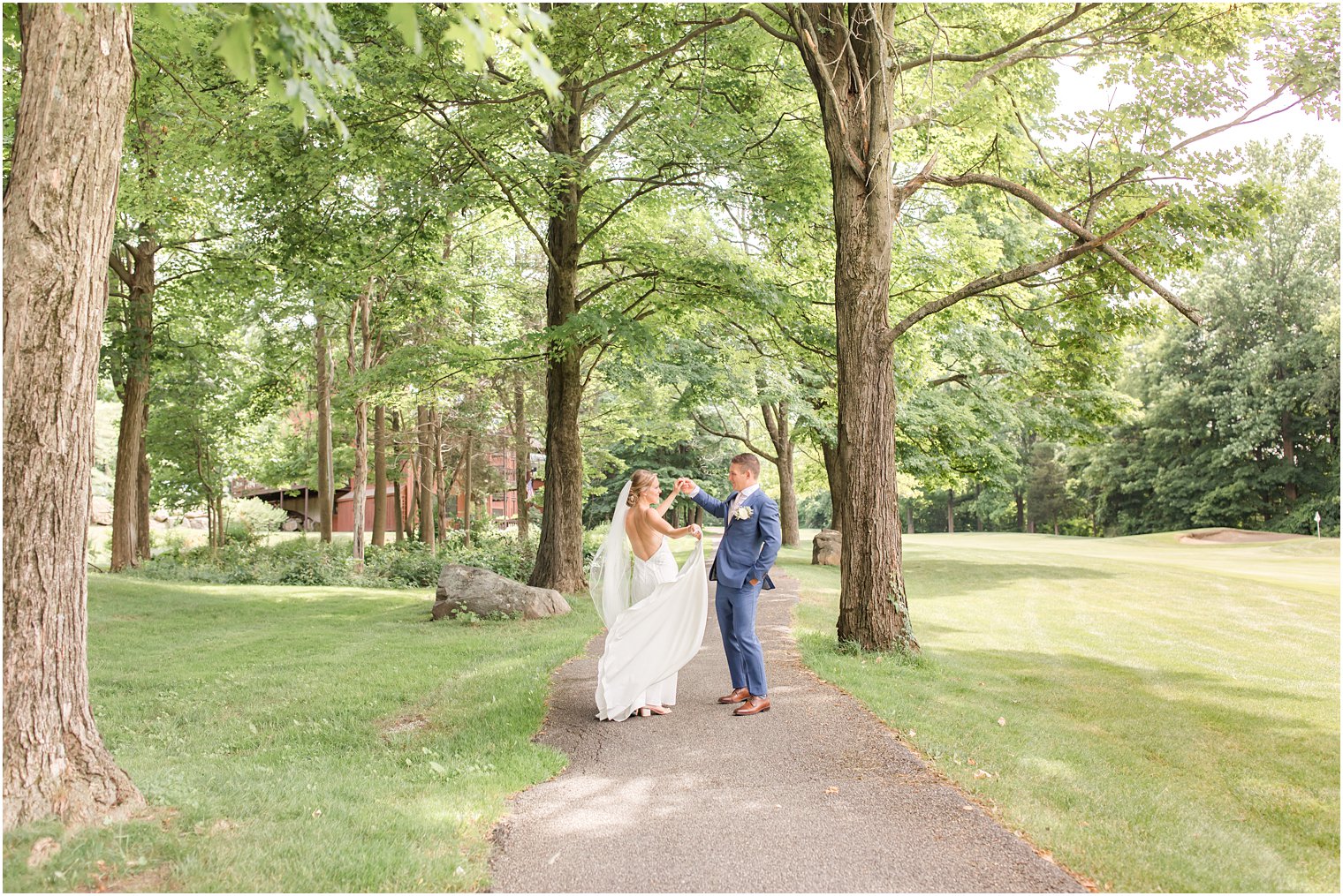 groom twirls bride on trail during wedding day at Minerals Resort