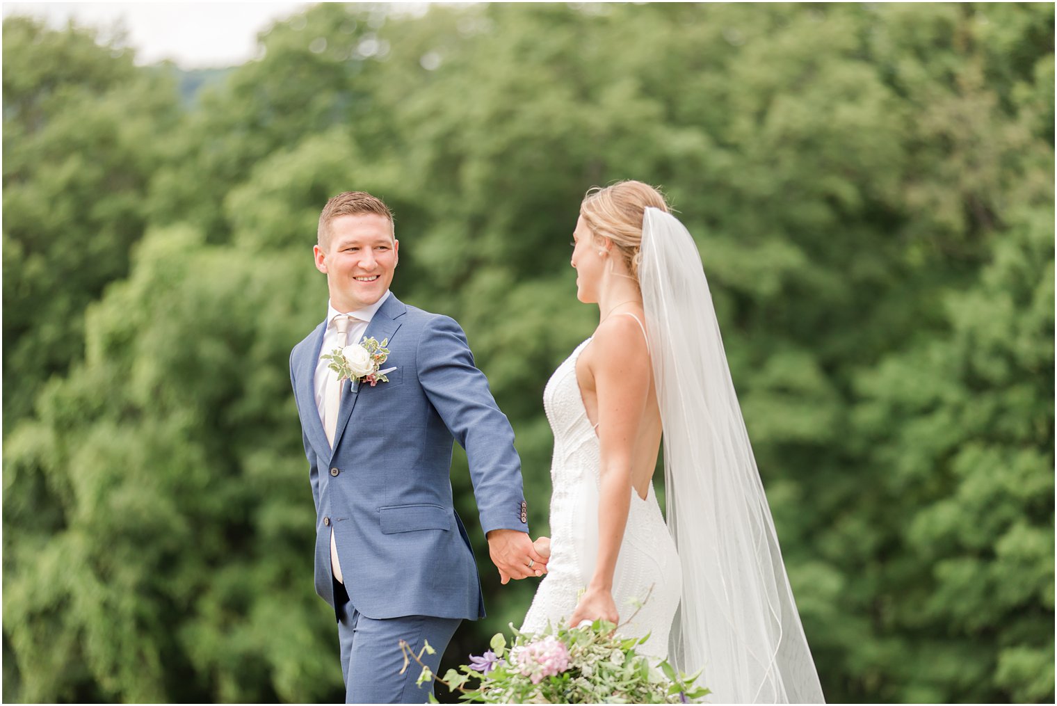 bride and groom hold hands walking through Minerals Resort