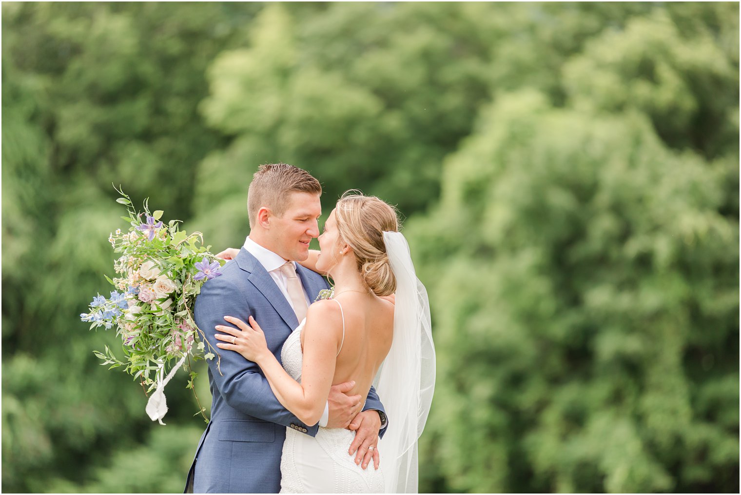 bride and groom touch noses during NJ wedding photos