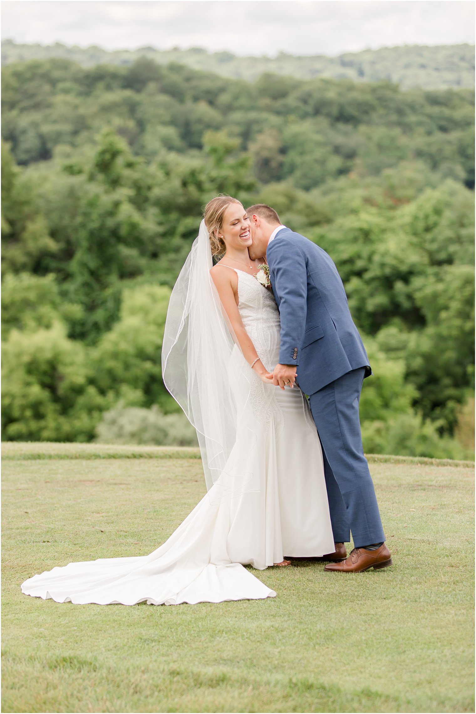 groom kisses bride's neck during Minerals Resort wedding portraits 