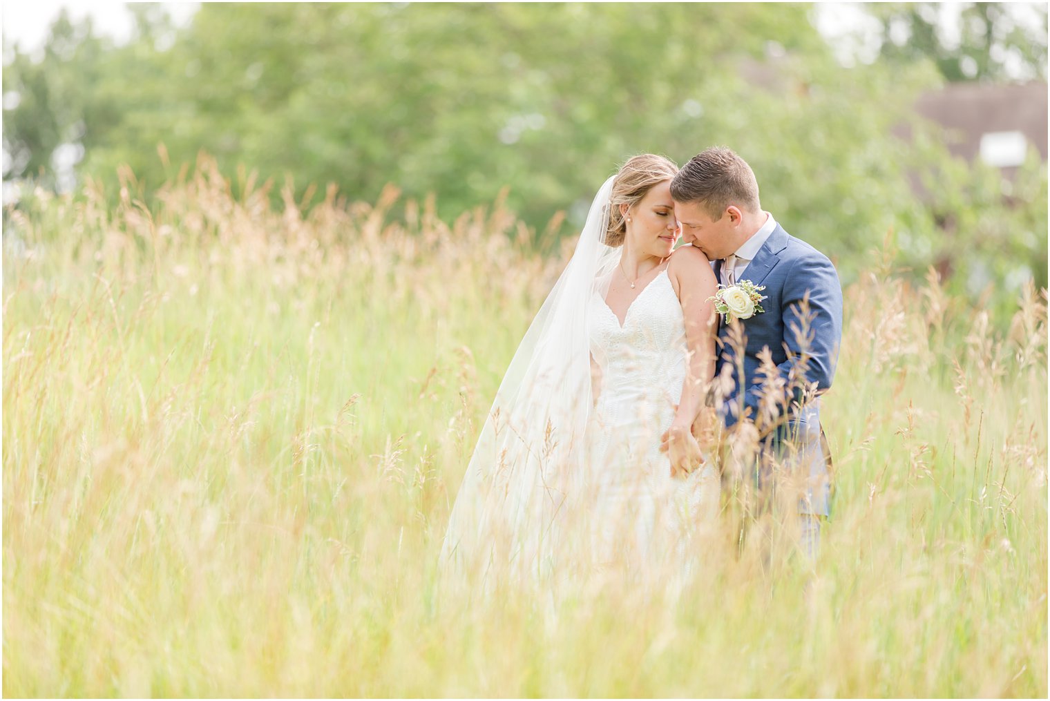 groom kisses bride's shoulder during wedding portraits at Minerals Resort