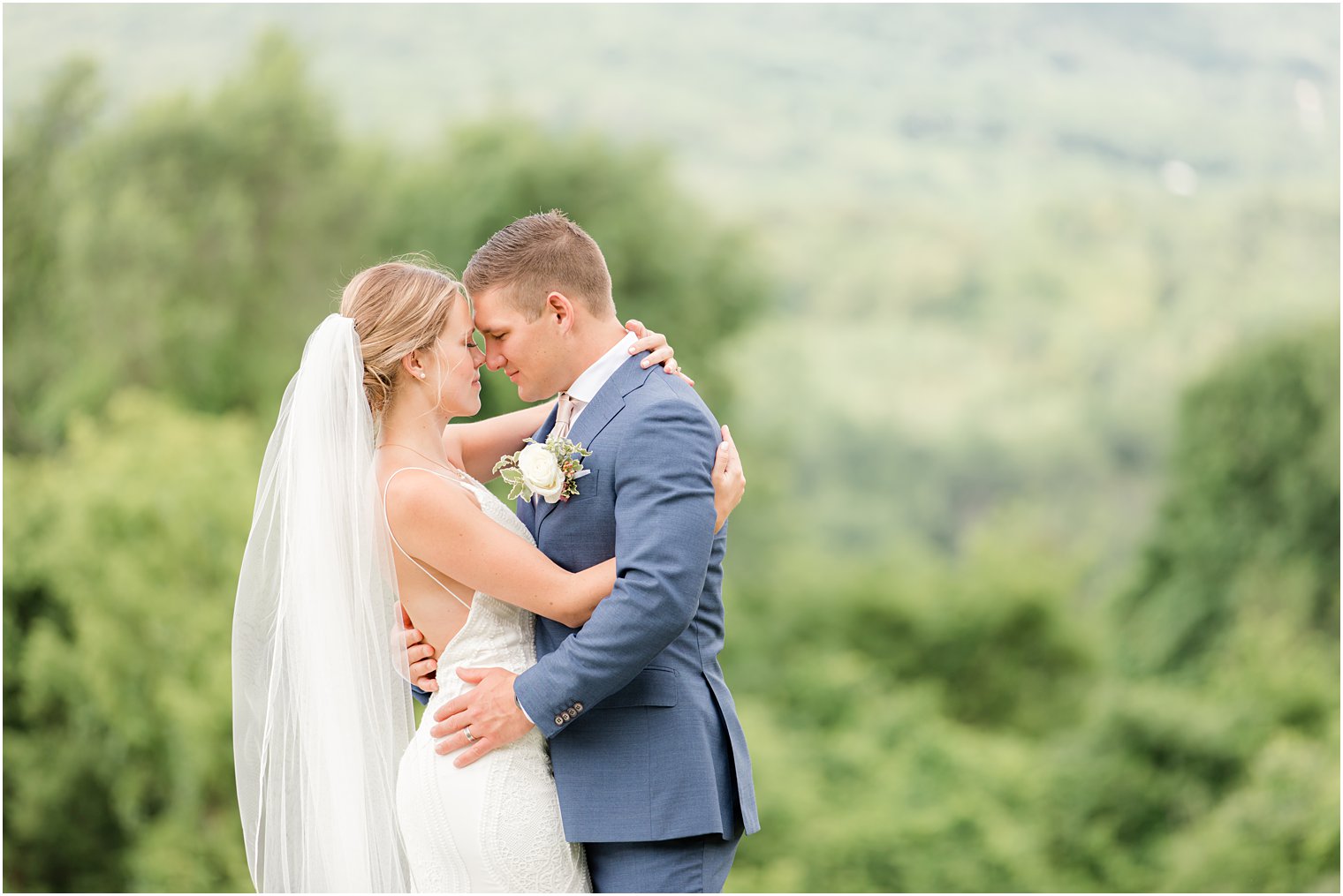 bride and groom stand touching noses during NJ wedding day