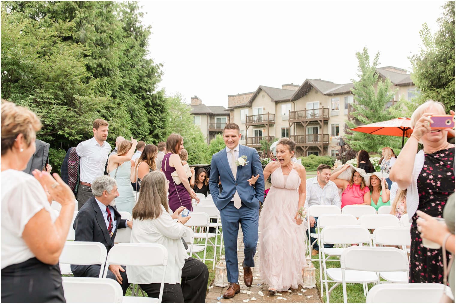 groom walks mother down aisle during rainy wedding ceremony in Vernon NJ