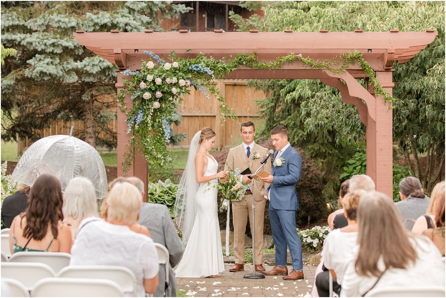 bride and groom read vows during rainy wedding ceremony at Minerals Resort