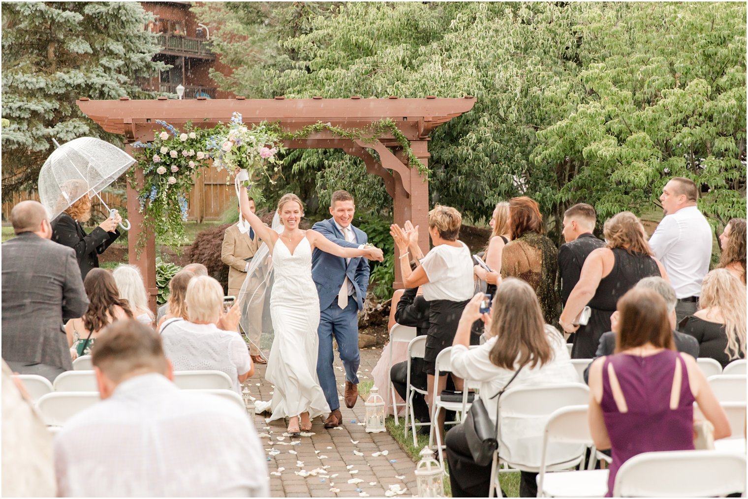 bride and groom leave ceremony in the rain at Minerals Resort