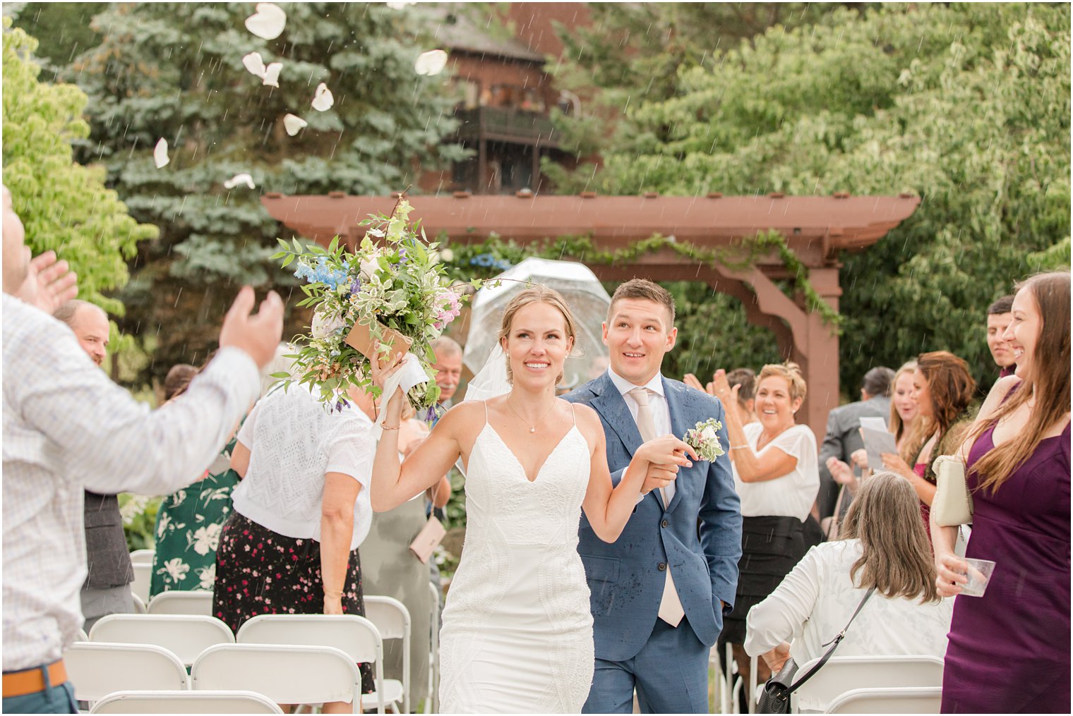 bride and groom leave wedding ceremony in the rain at Minerals Resort