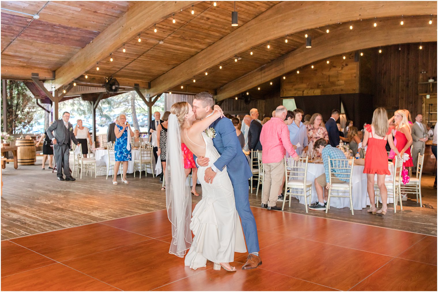 groom kisses bride on dance floor at Minerals Resort