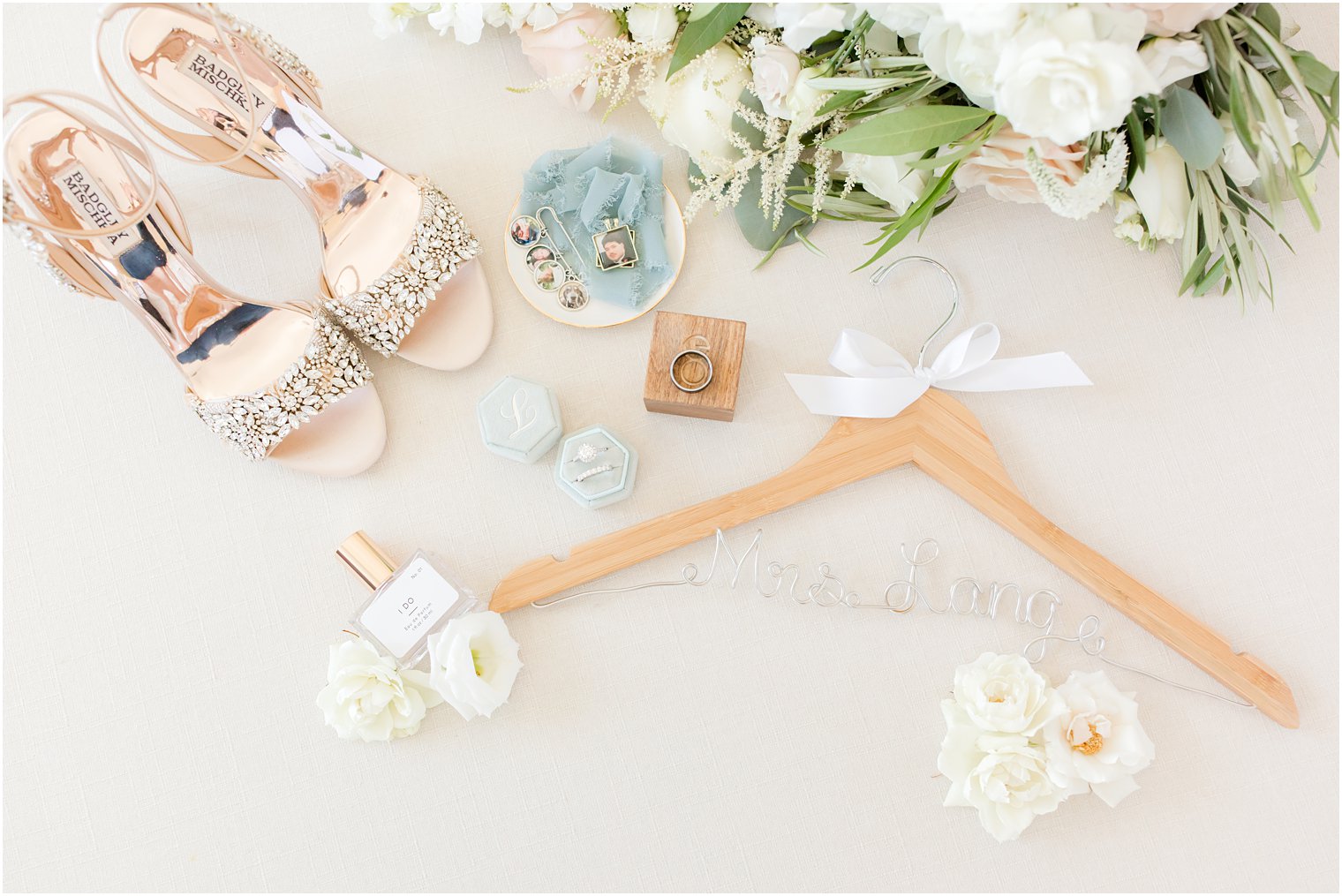 bride's shoes, rings, and wooden hanger for NJ wedding