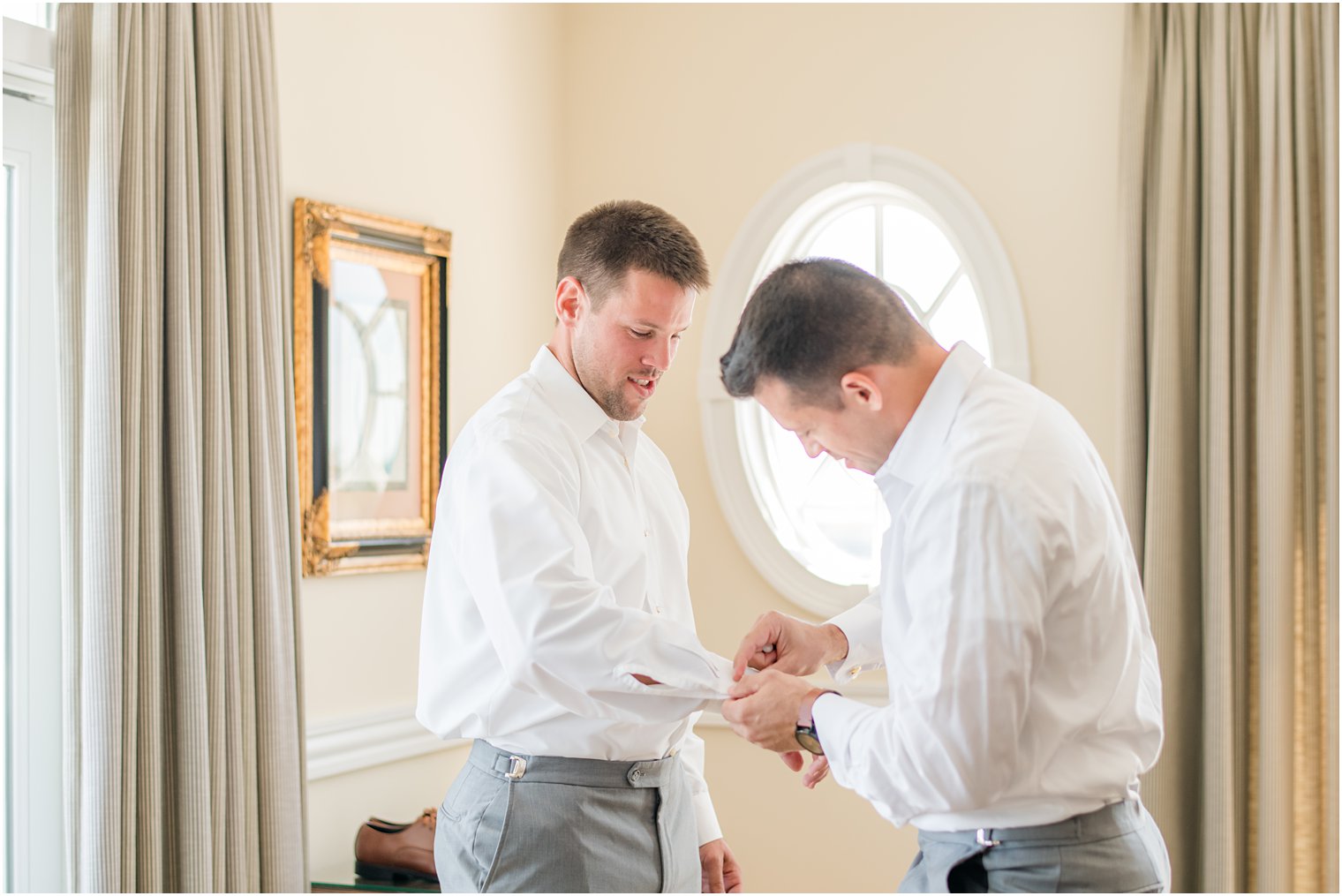 groomsman helps groom with cufflinks before Bonnet Island Estate wedding