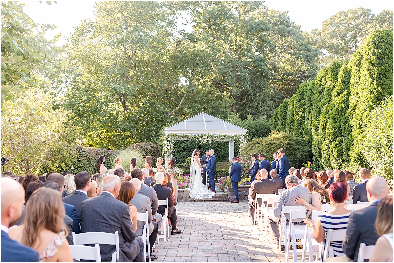 bride and groom stand together during ceremony at The Mill Lakeside Manor