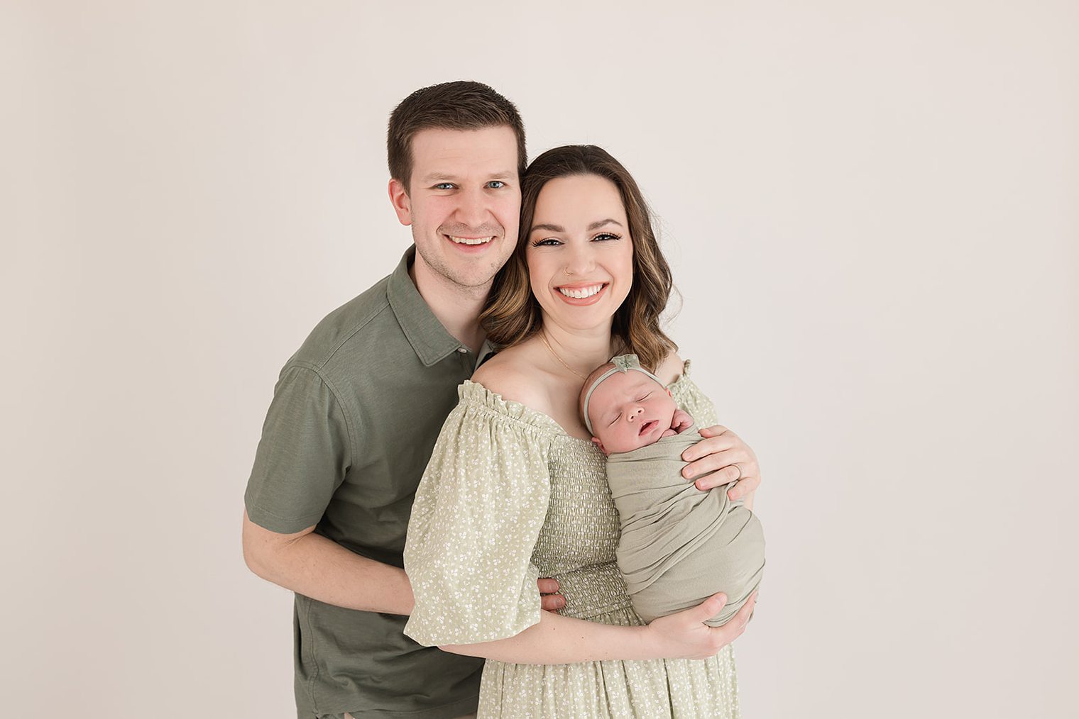 baby girl with her mom and dad