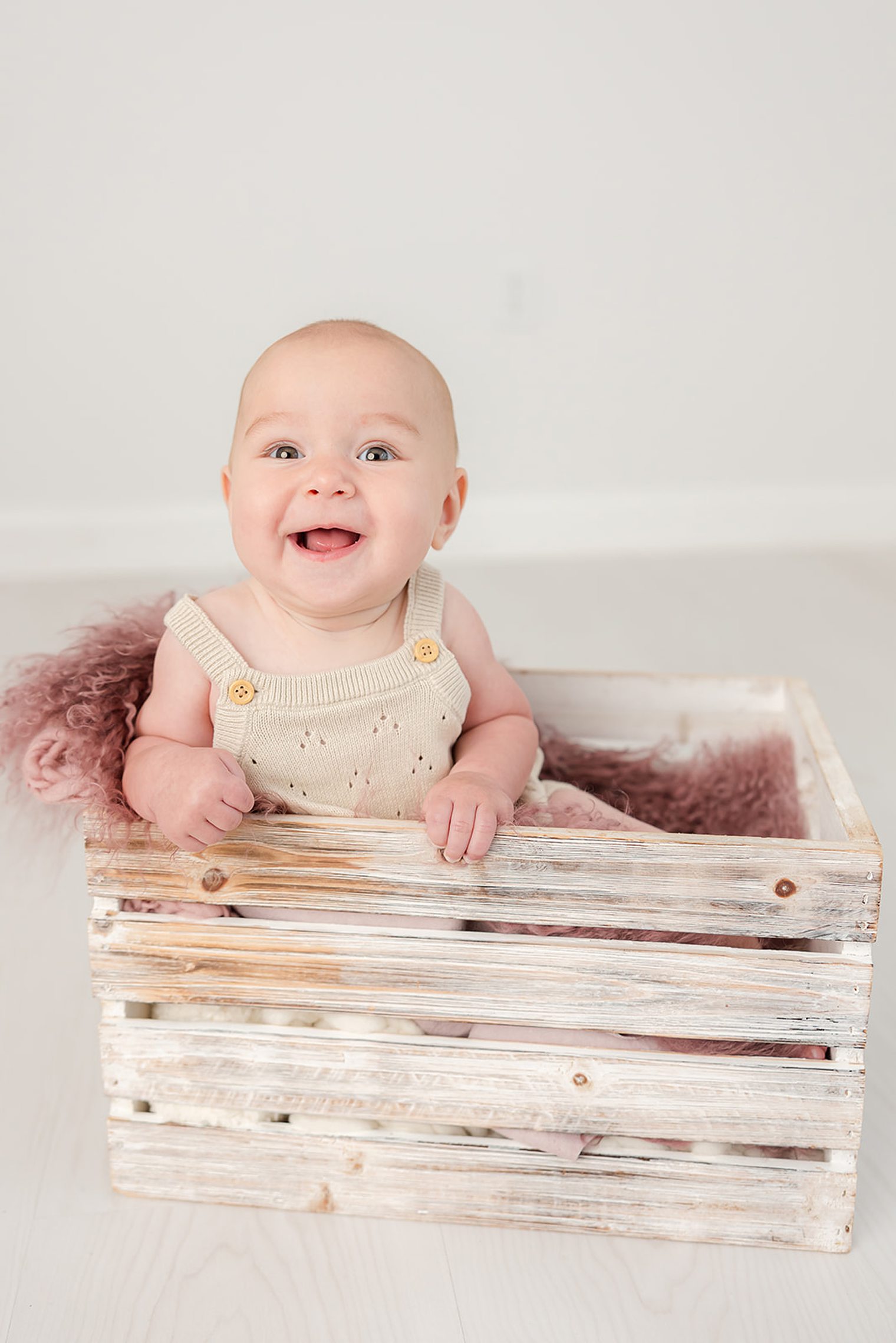 happy baby girl at her milestone session 