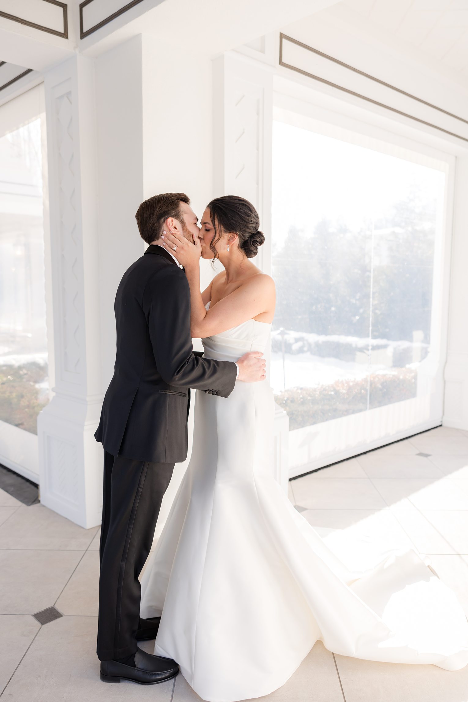 bride and groom sharing a first kiss after their first look