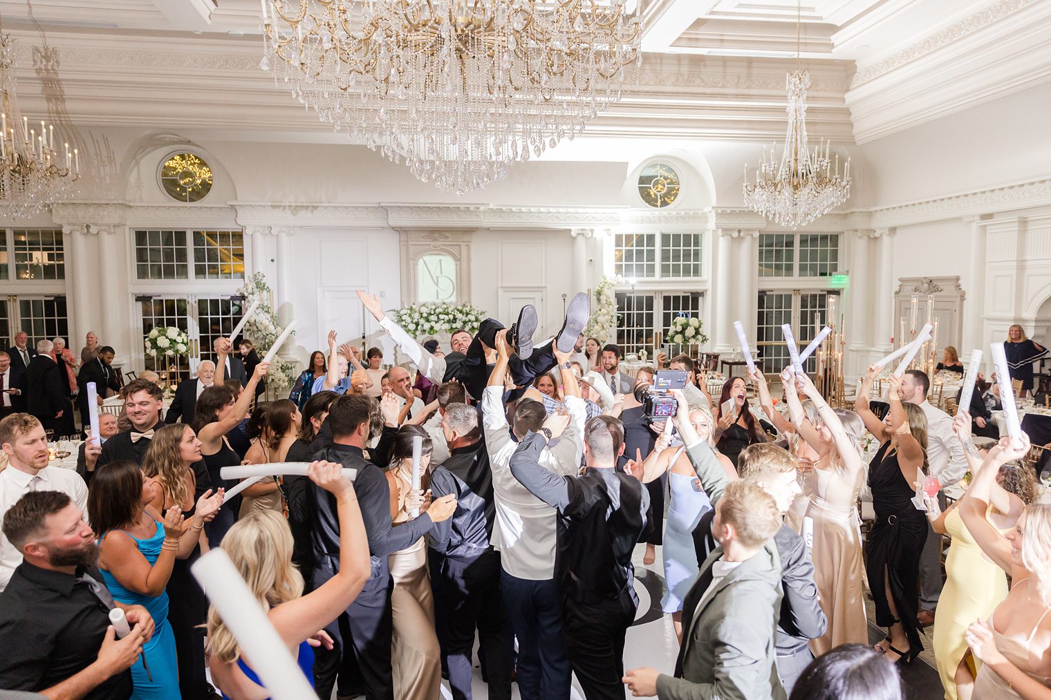 husband and wife celebrating with their families and friends 