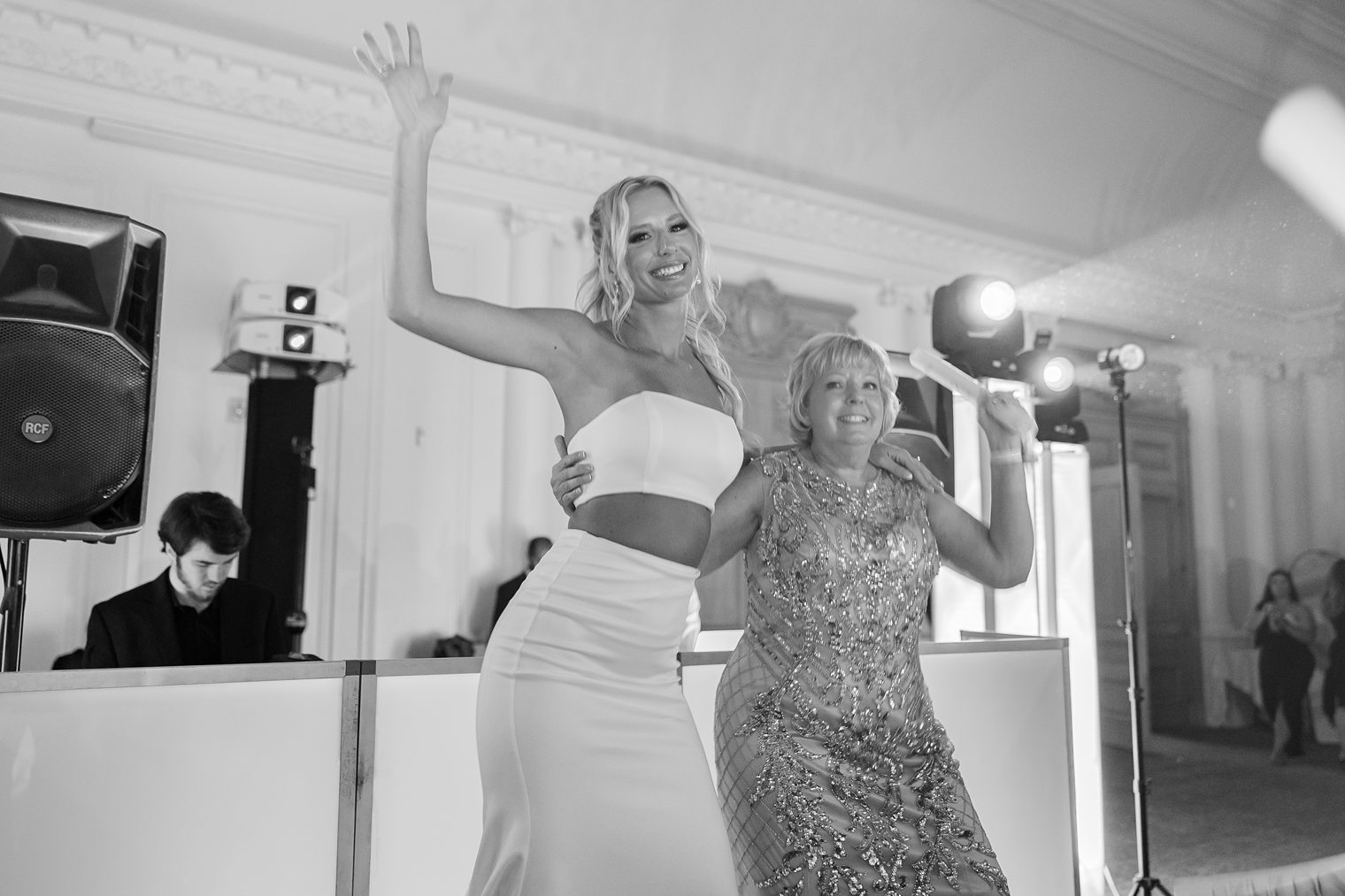 bride enjoying next to her mother 