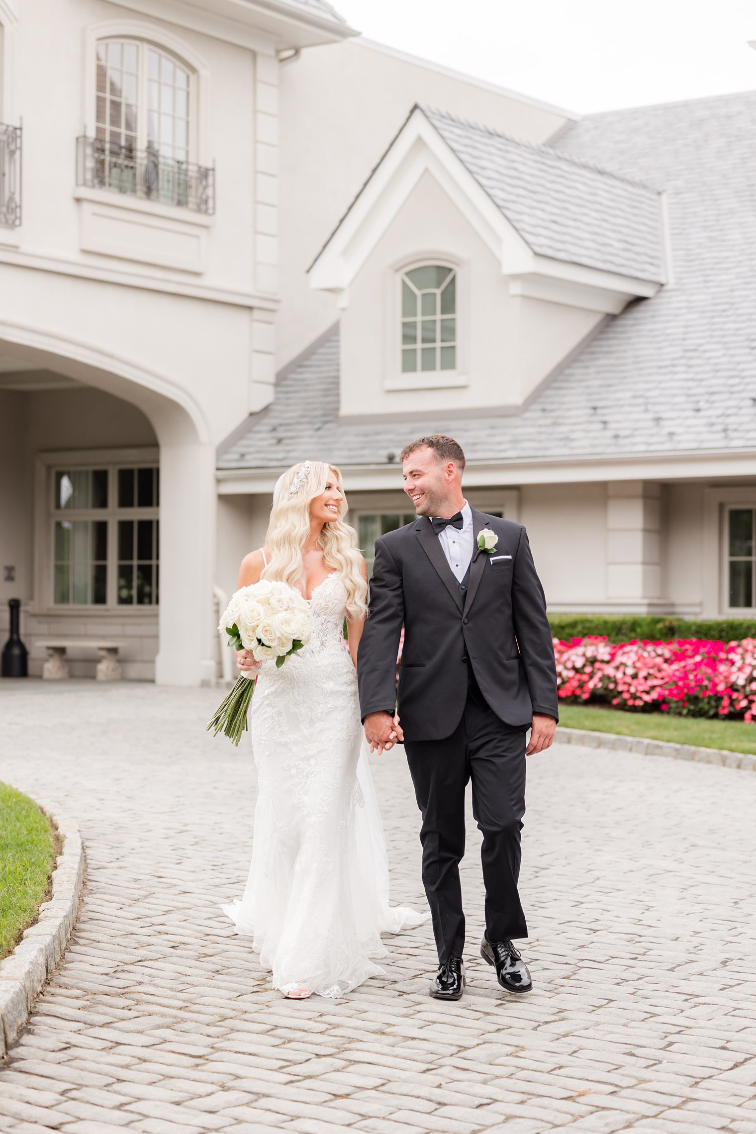 groom and bride taking a walk while they look each other 