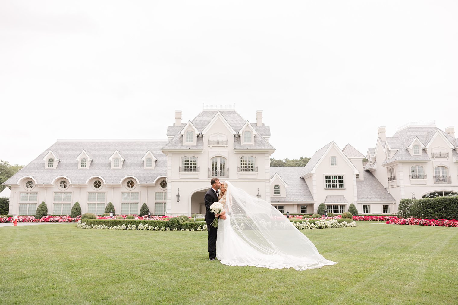 groom kissing his bride 