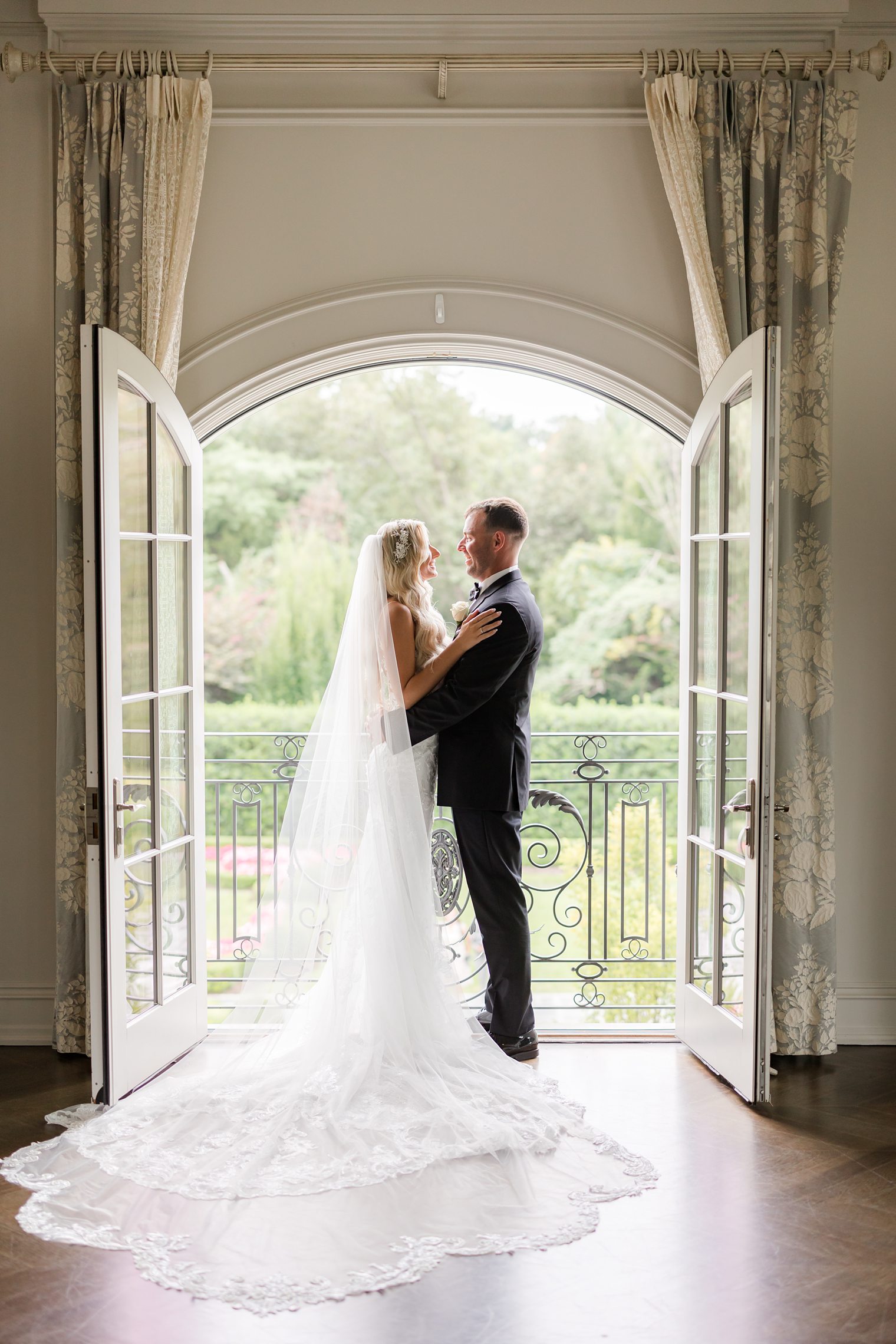 bride and groom looking each other face to face 