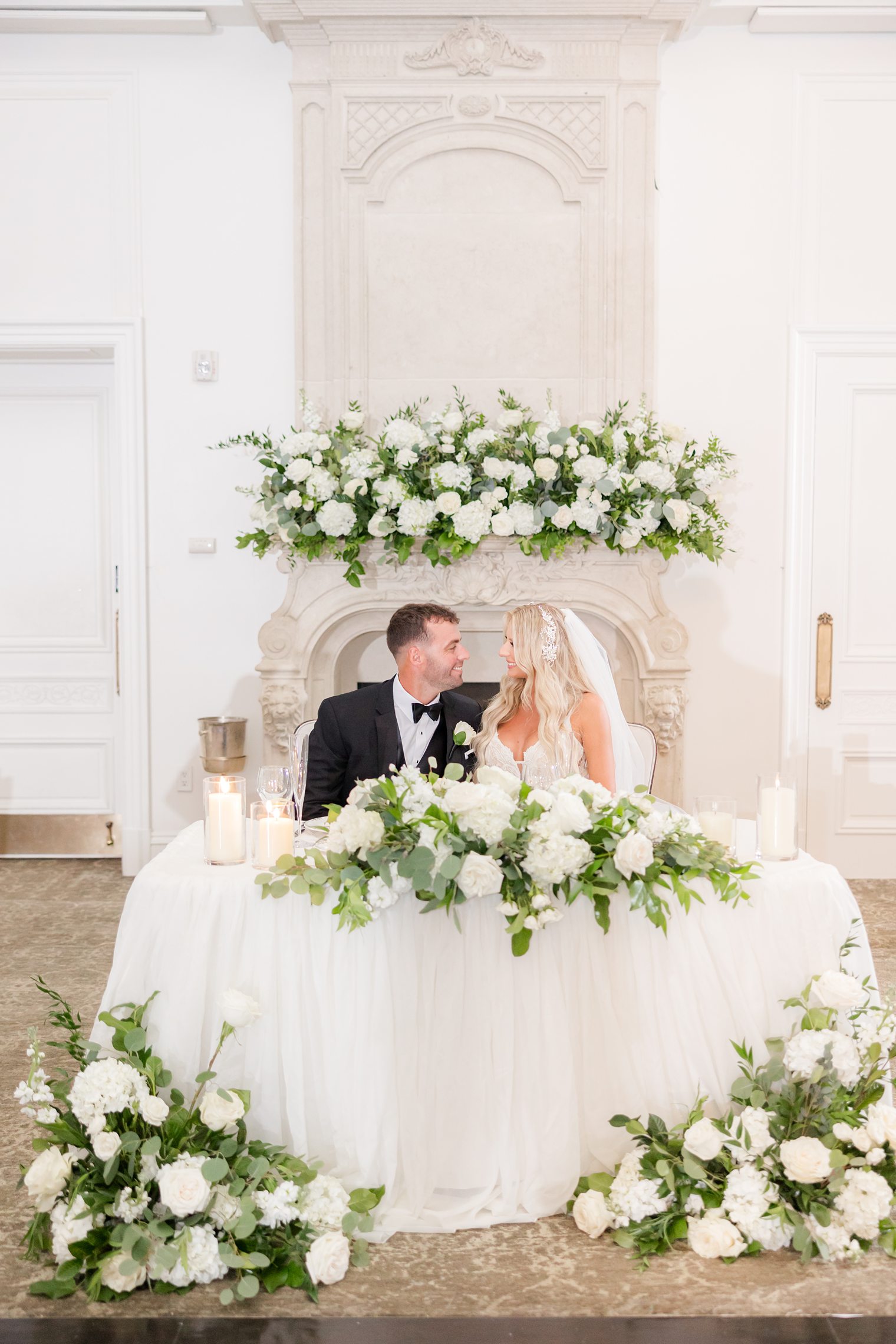 Mr. and Mrs. at their sweet heart table 