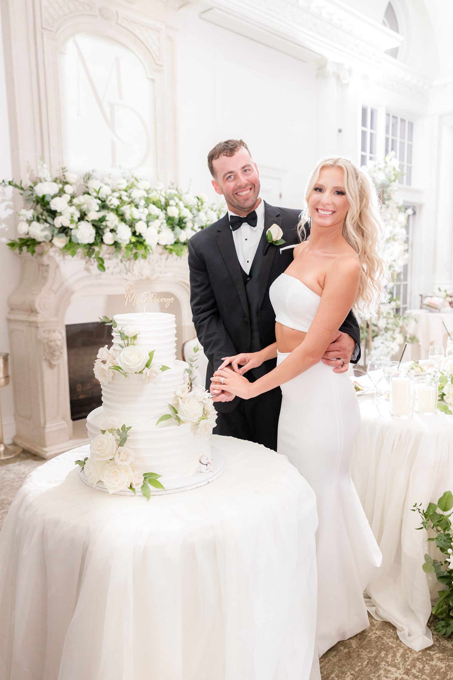 Mr. and Mrs. cutting their cake 