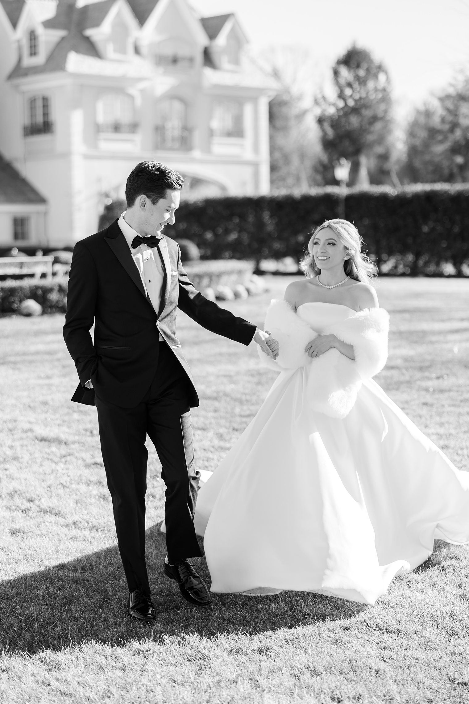 bride and groom walking hand by hand