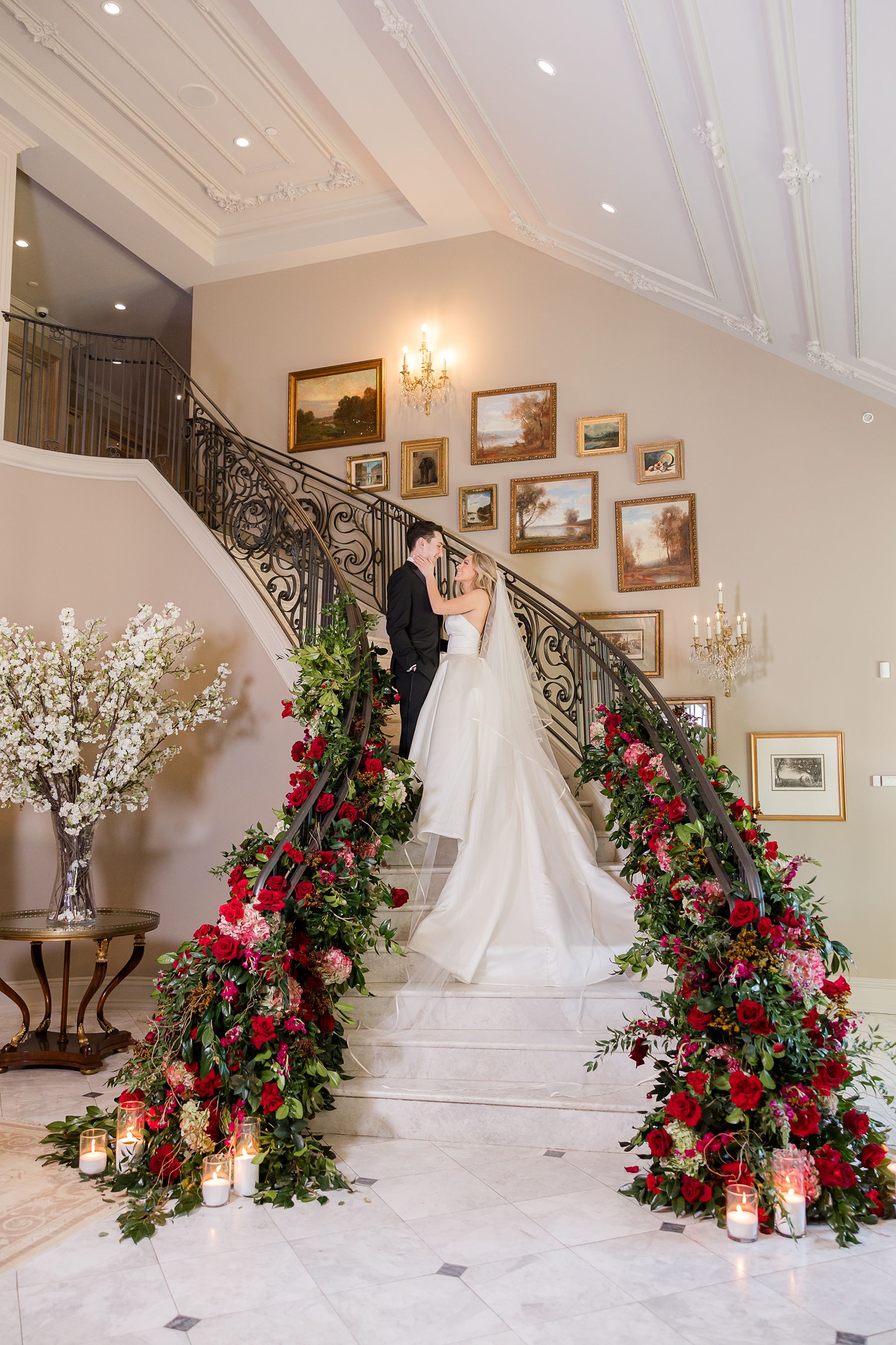 bride and groom posing on the staircase at Park Chateau Estate