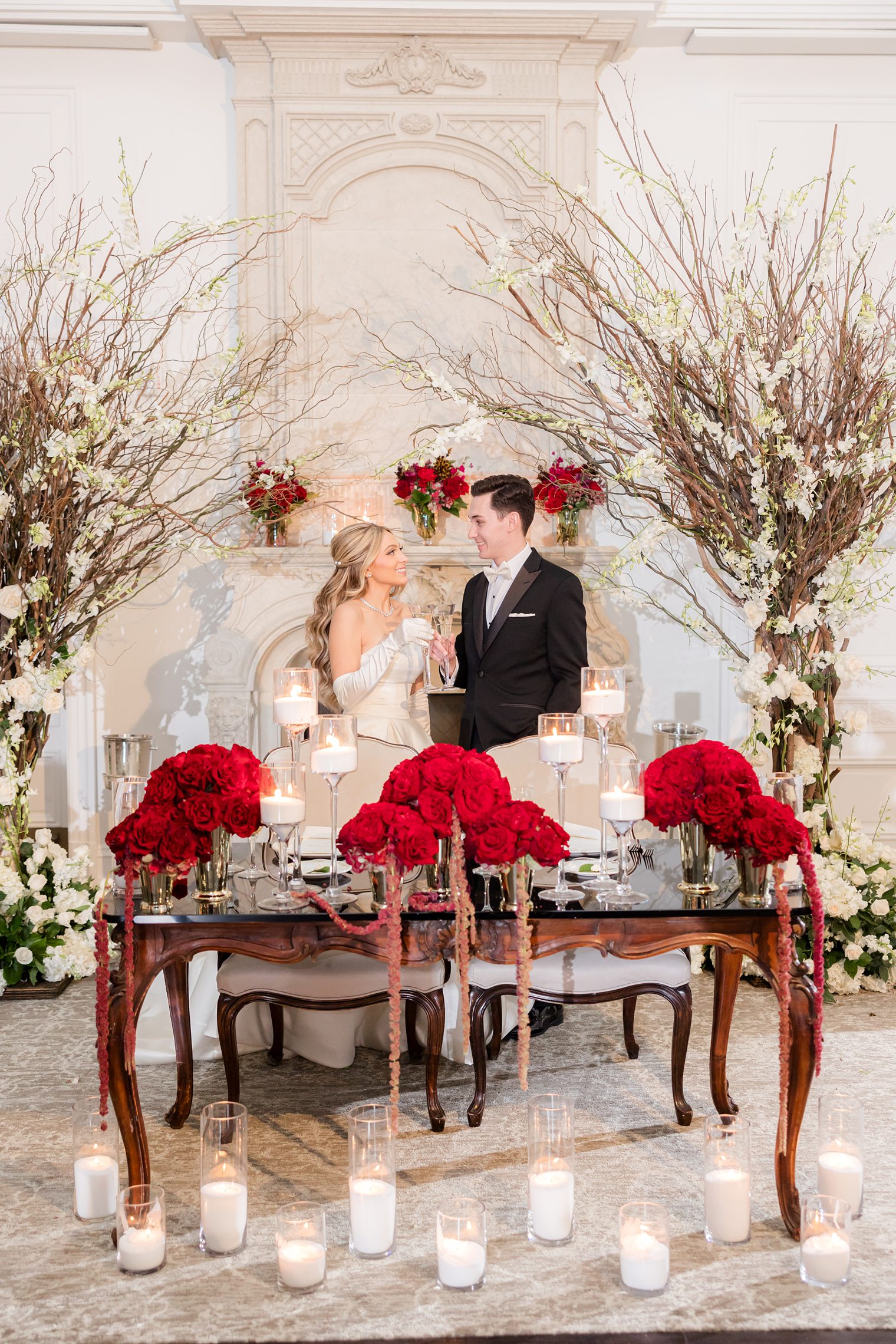 husband and wife sitting in their sweet heart table