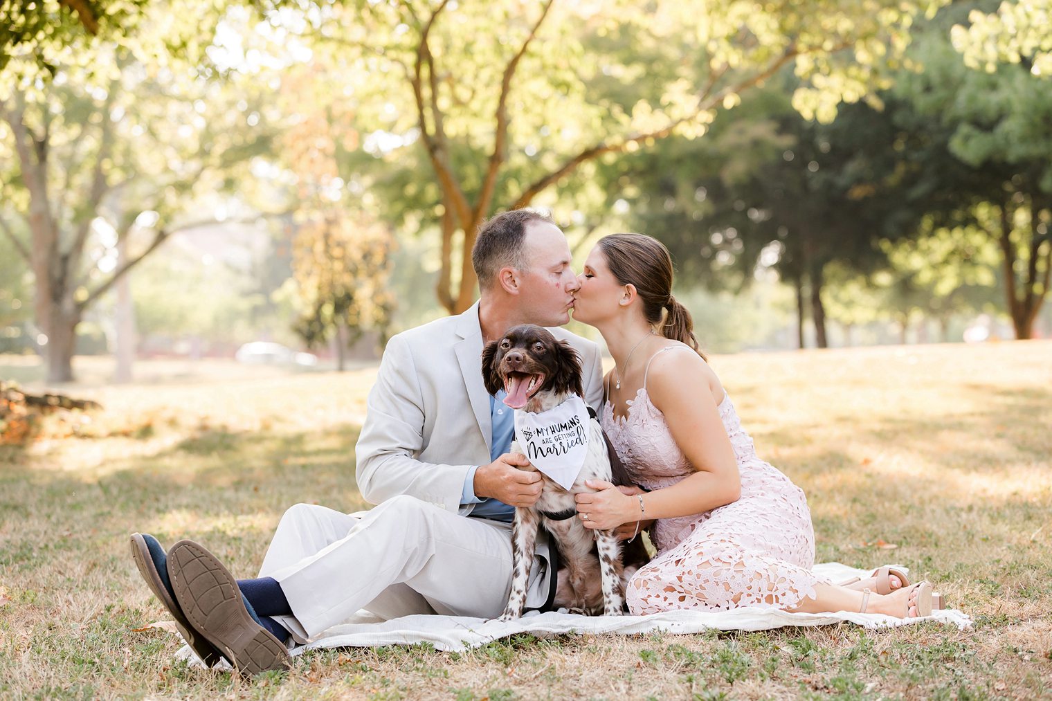 groom and bride sharing a kiss for the engagement shoot at Spring Lake