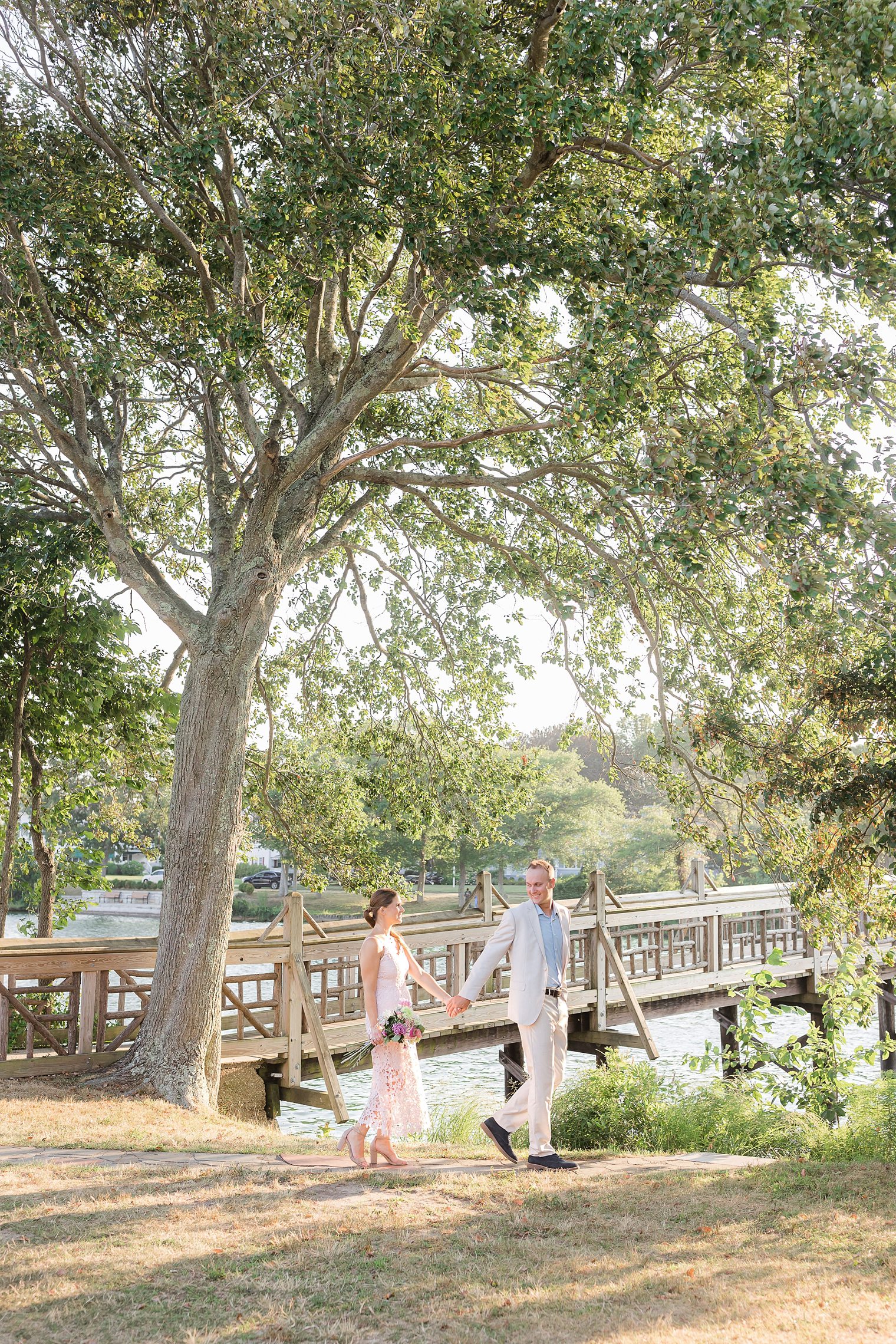 groom and bride taking a walk at Spring lake