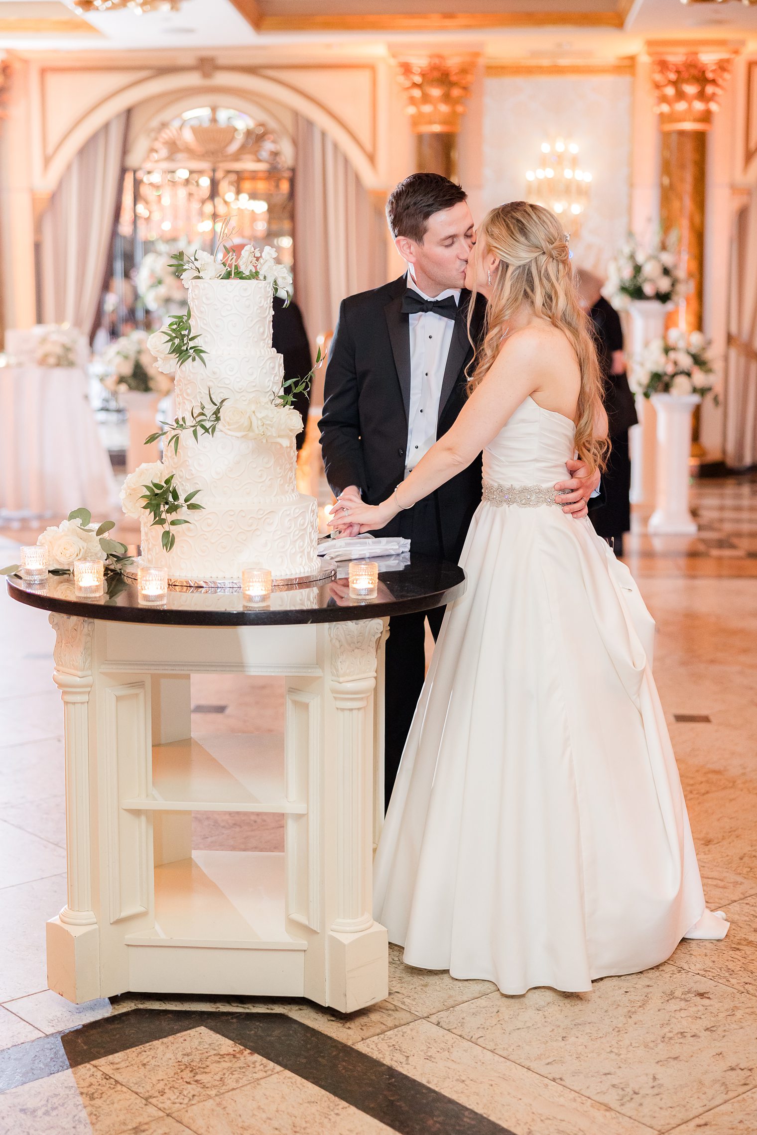 husband and wife cutting their wedding cake 