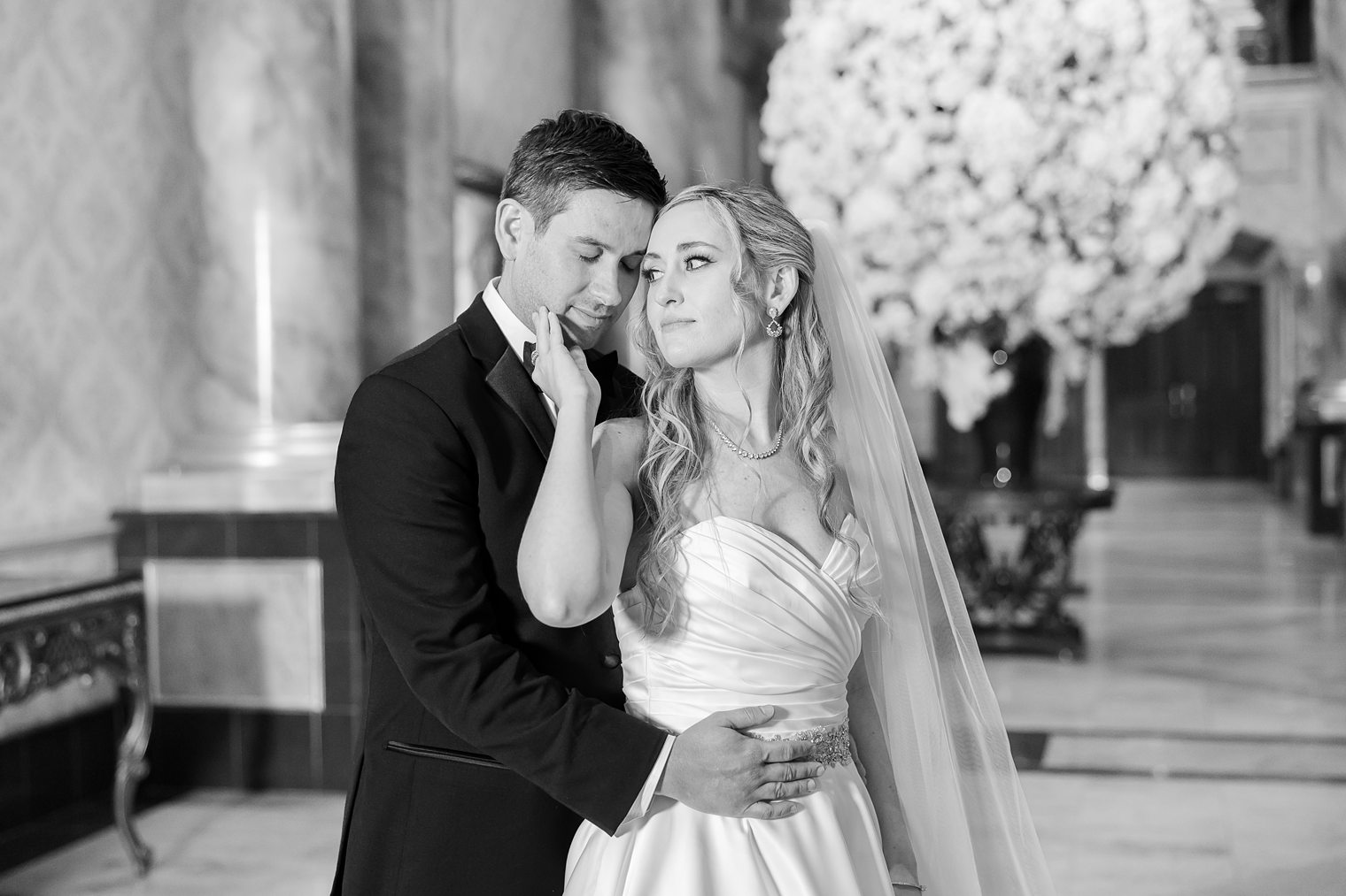 bride putting her hand on her husband's face