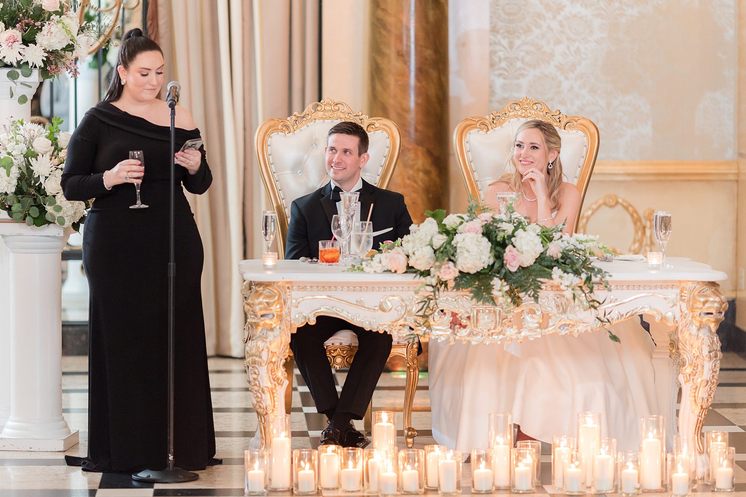 husband and wife at their sweet heart table 