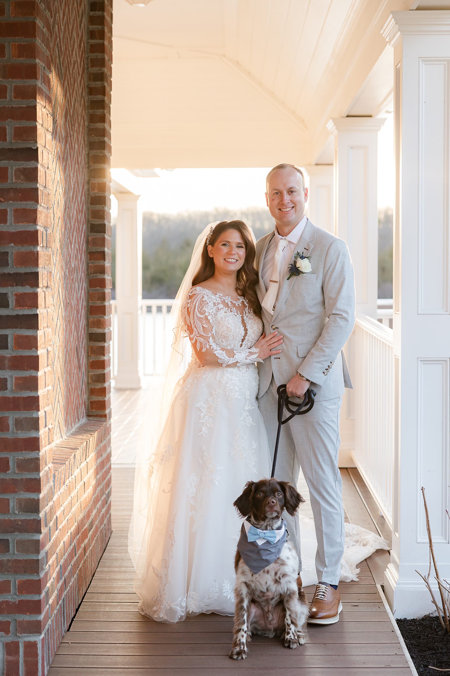 husband and wife with their furry friend 