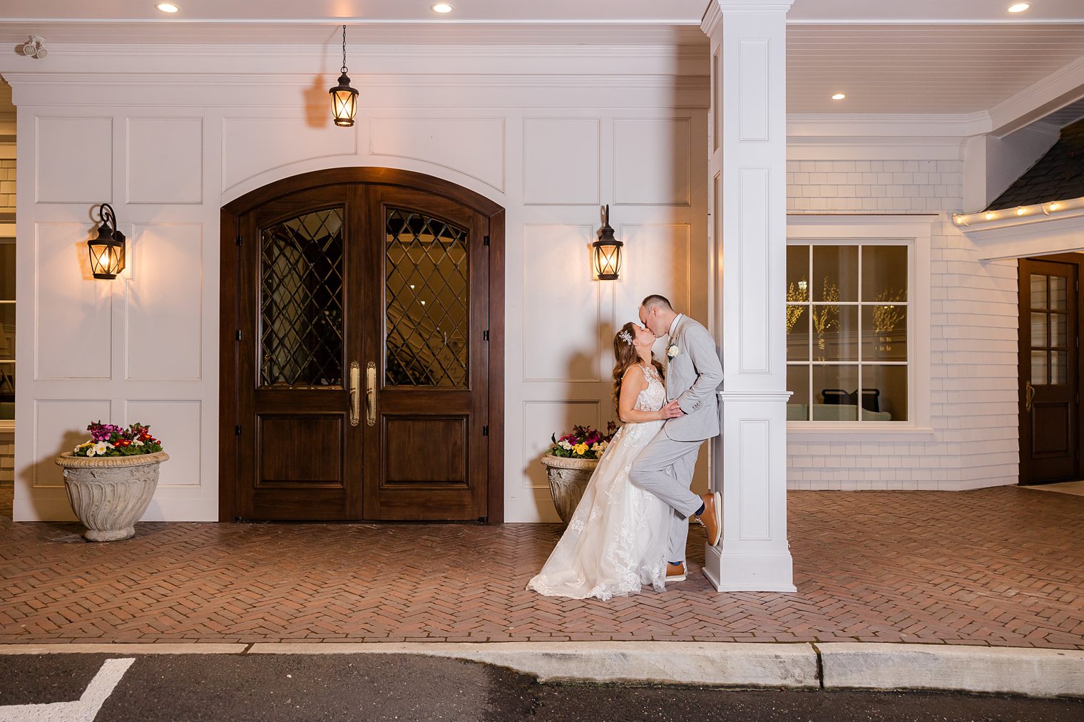 husband and wife sharing a kiss at the end of the night 