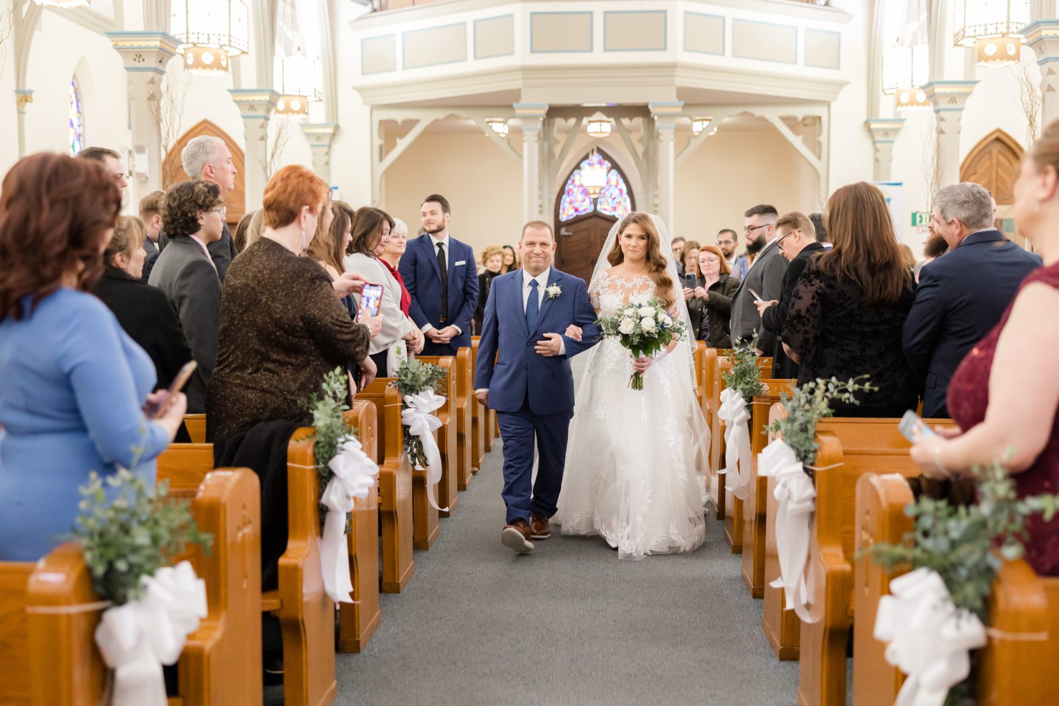 bride walking the aisle with her father