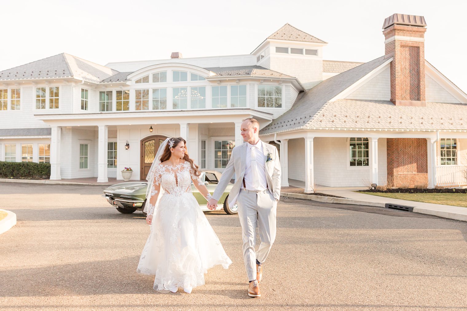 husband and wife walking while they hold their hands 