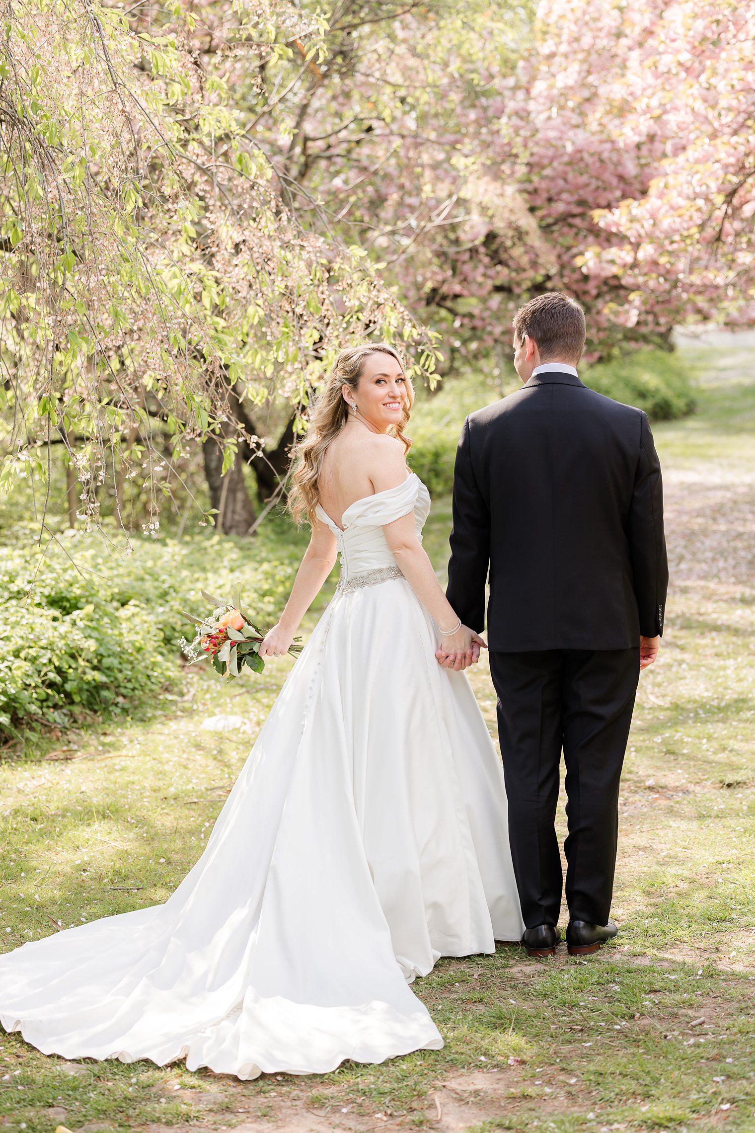 husband and wife walking while holding hands 