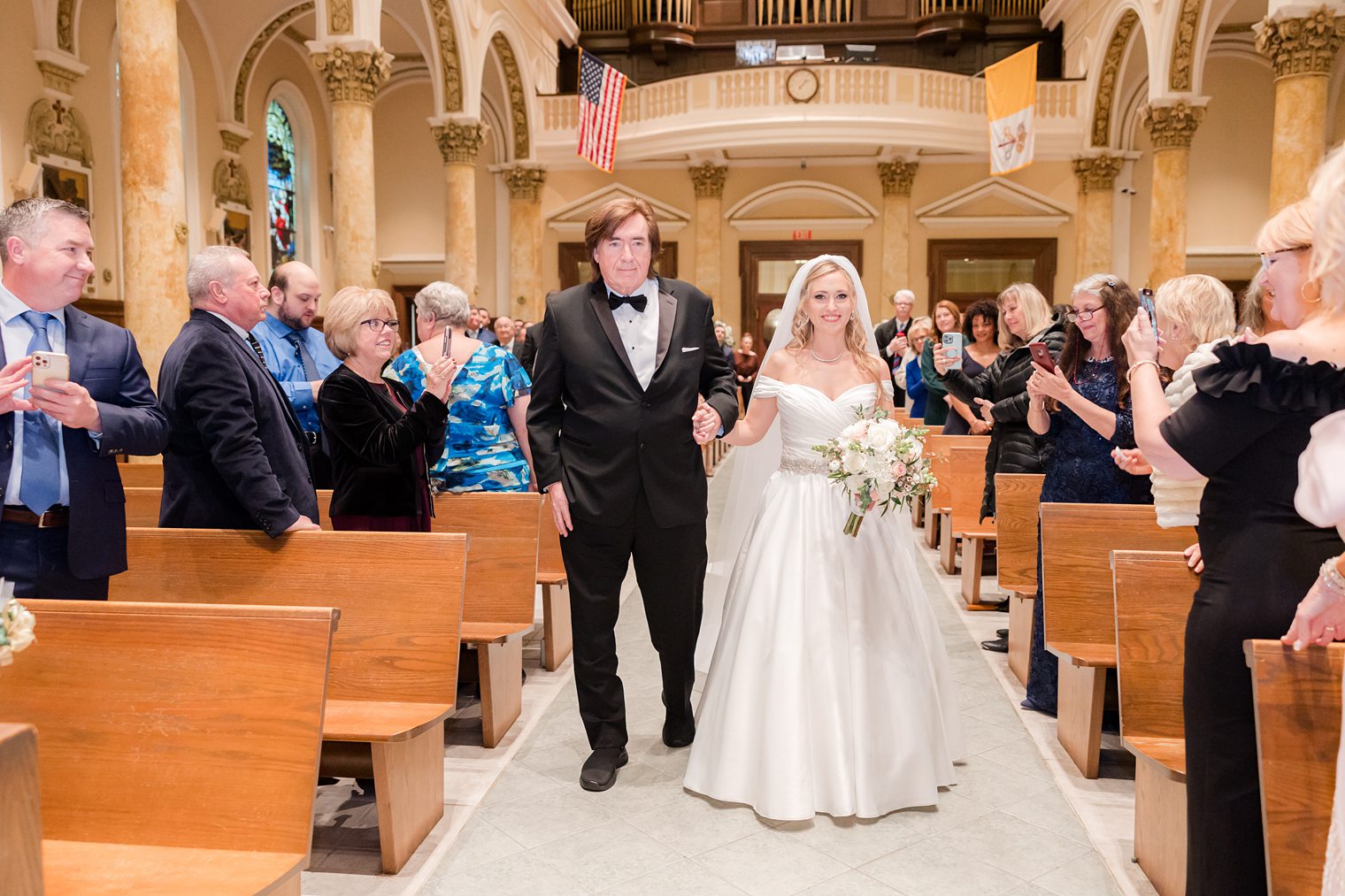 bride and her dad walking into the aisle 